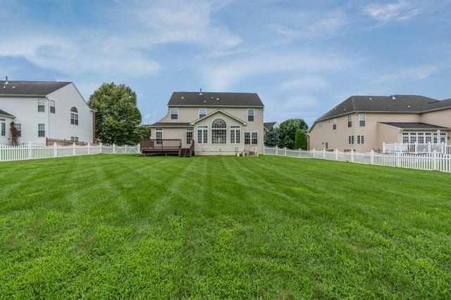 Residential houses view from green grass lawn, highlighting the importance of home appraisal in mortgages