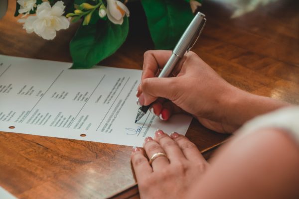 a woman signing a second mortgage