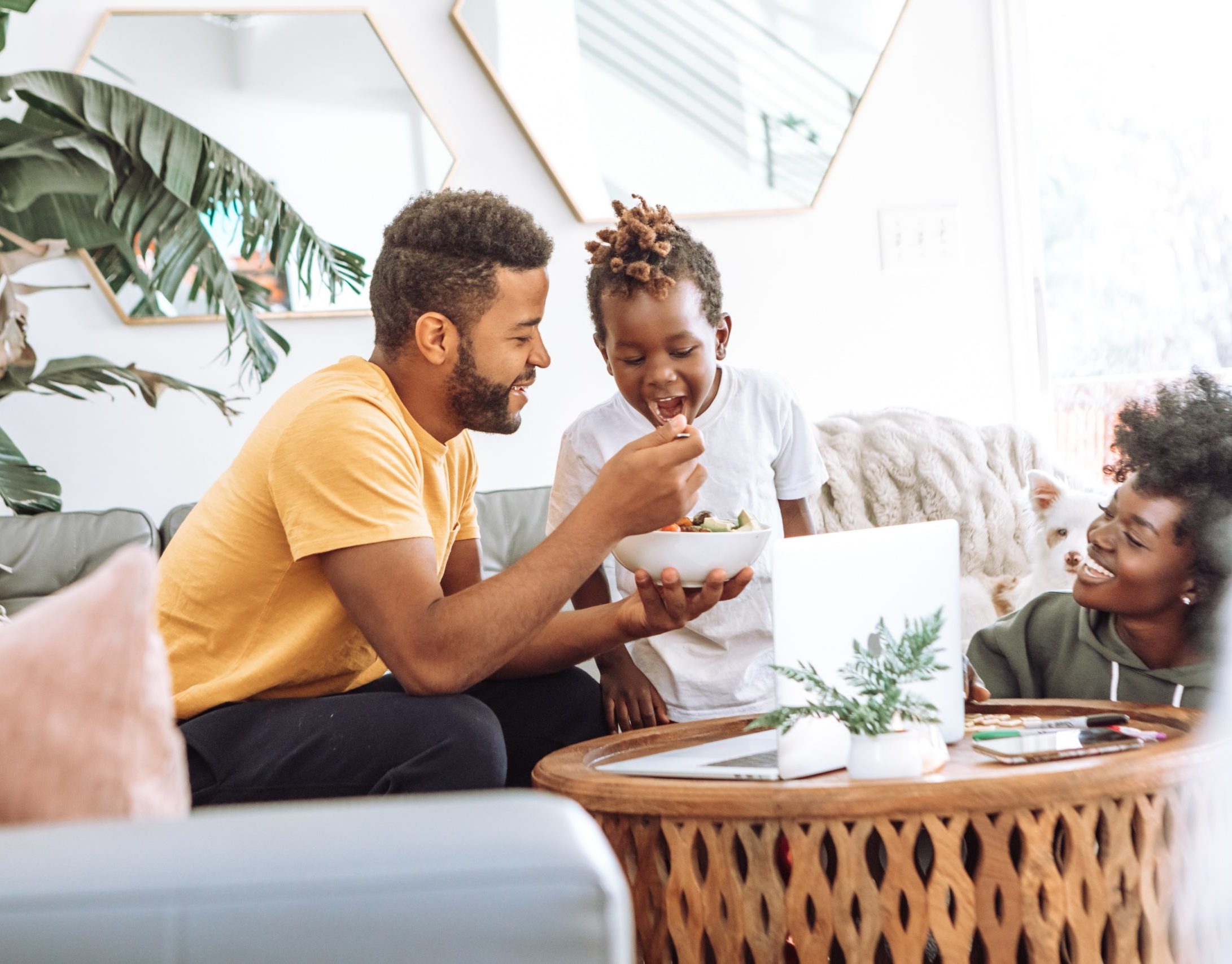 A family eating and smiling.